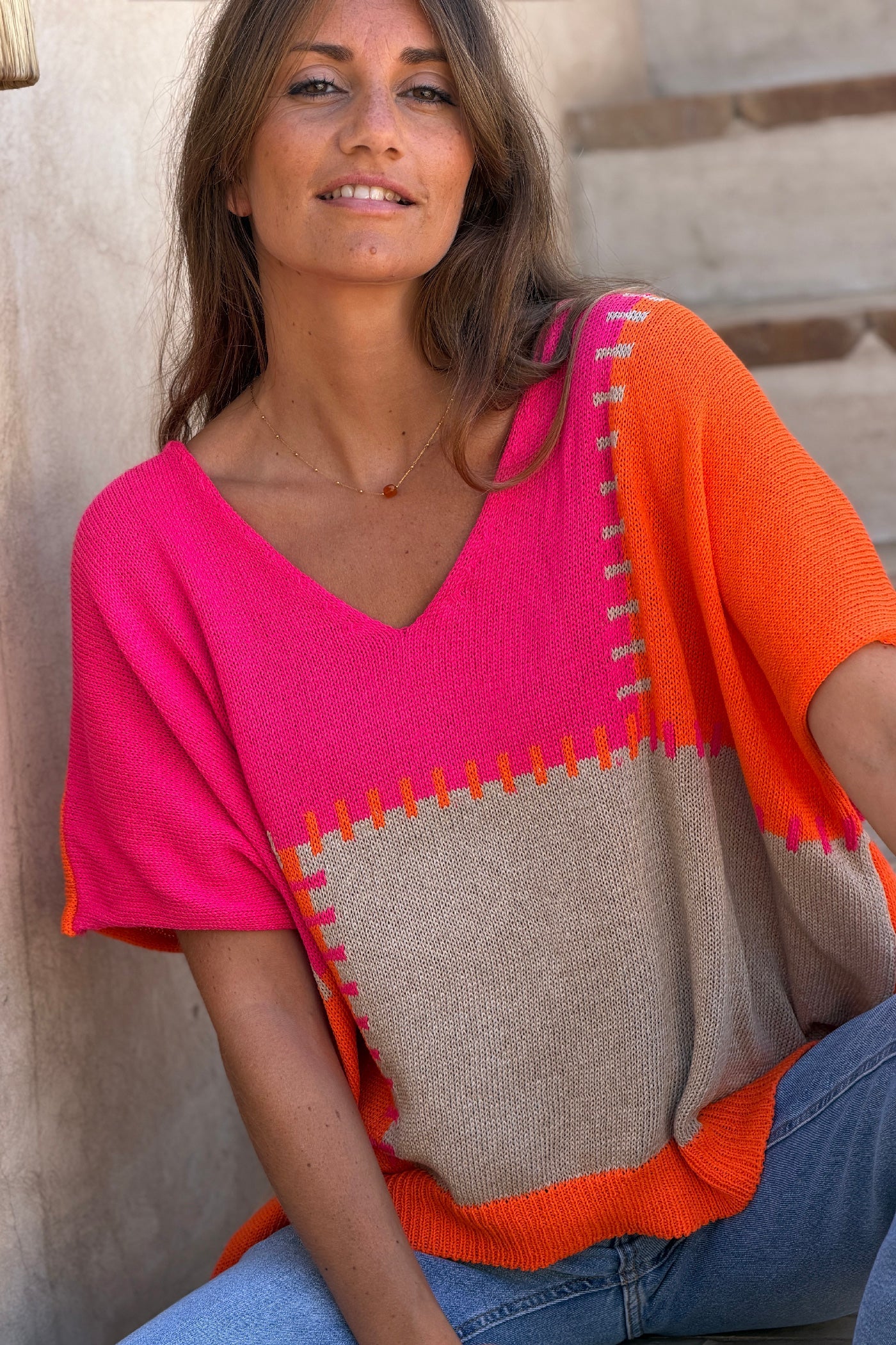 Lidia - Suéter holgado de punto de algodón con diseño de patchwork en naranja y fucsia